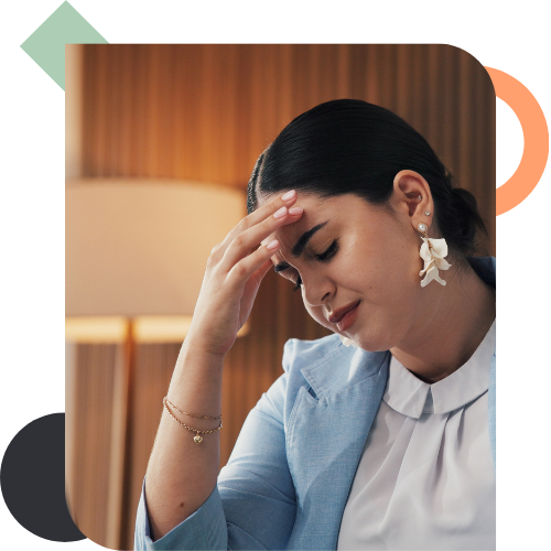 A stressed manager holding her head in her hands, illustrating the fatigue caused by repeated conversations and slow progress due to a lack of team alignment.