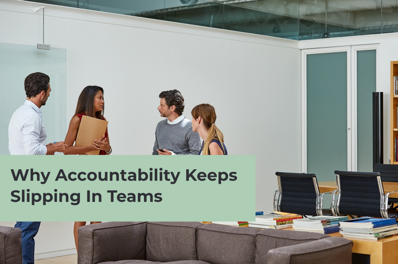 An article banner titled "Why Accountability Keeps Slipping In Teams" features a bright, modern open-office setting. Four professionals stand in a semi-circle having a discussion: a man in a white shirt, a woman holding a brown folder, a man in a grey sweater, and a woman with her blonde hair tied back. In the foreground, a large sage green rectangular overlay repeats the title text. Office furniture, including a brown sofa and conference chairs, is visible in the background.