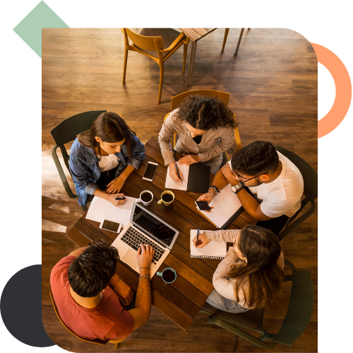 A group of professionals engaging in a collaborative workshop, illustrating the Pack Performance System (PPS) designed to reset team operations, communication, and collective decision-making.